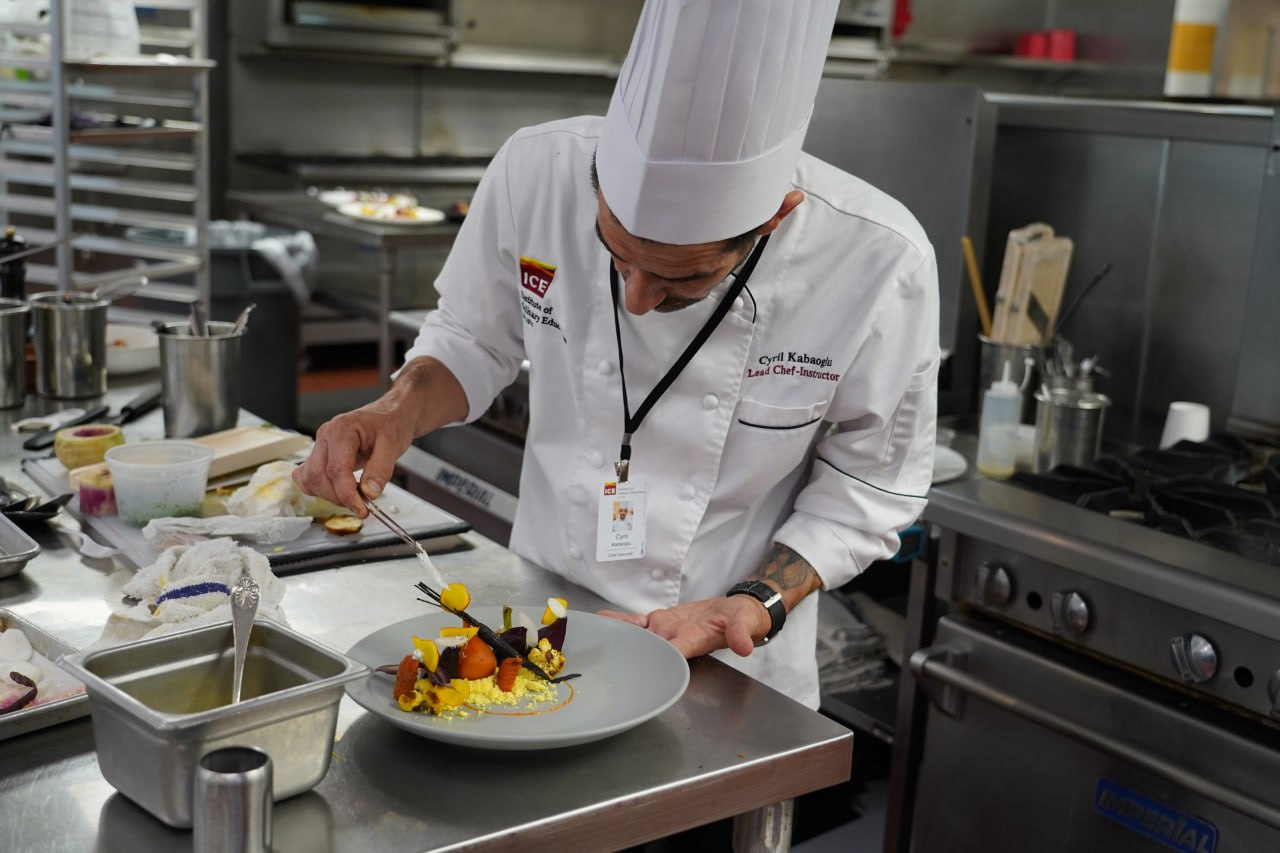 Chef Cyril Kabaoglu plating in the kitchen